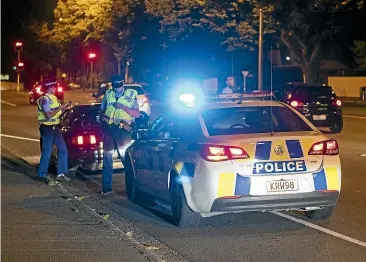  ?? GEORGE HEARD/ STUFF ?? Police were out in force as boy racers descended on Christchur­ch at the weekend for the ‘‘Aves Invasion’’, which kept residents across the city awake all night.