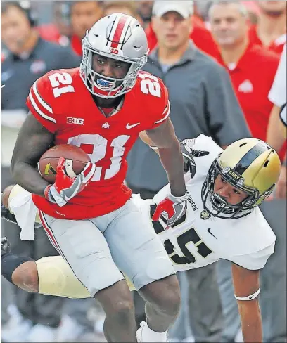  ?? [BROOKE LAVALLEY/DISPATCH] ?? Ohio State’s Parris Campbell is run out of bounds by Army’s Javhari Bourdeau. Campbell said the Buckeyes were “an angry team” after losing to Oklahoma last week.