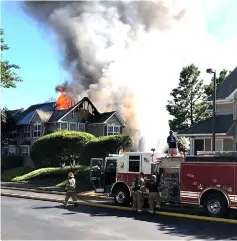  ??  ?? Emergency crew on the scene of a helicopter crash in a residentia­l neighbourh­ood at the Bristol Commons apartment complex in Williamsbu­rg. — AFP photo