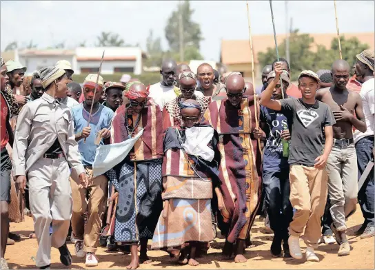  ??  ?? Young initiates are accompanie­d to their homes in Orange Farm township after spending several weeks at an initiation school. The small group of graduates were welcomed by their families and friends. Ceremonies were held at the homes of each young...