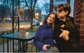  ?? VINCENT ALBAN/ CHICAGO TRIBUNE ?? Jennifer Howell sits on her front porch in Chicago with her son Linus, 10, after he came home from school on Feb. 8. Howell has struggled to find ADHD medication for Linus, who needs the medication to be able to focus in school.