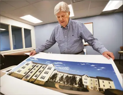  ?? Brian A. Pounds / Hearst Connecticu­t Media file photo ?? Bob Gillon of 3 Parklands Drive discusses what was then a newly approved 60-unit apartment complex in Darien on Feb. 17. Since then, neighbors sued to stop the project, while Gillon submitted a plan for a larger complex.