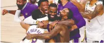  ?? KIM KLEMENT/ USA TODAY SPORTS ?? The Lakers celebrate their win over the Miami Heat after Game 6 of the 2020 NBA Finals, in a year where the major leagues tried to keep the revenue flowing as best they could.