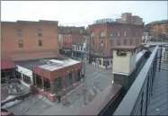  ?? PHOTOS BY LAUREN HALLIGAN — MEDIANEWS GROUP ?? The apartment building’s rooftop overlooks Caroline and Putnam streets in downtown Saratoga Springs.