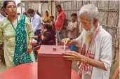  ?? — PTI ?? A senior citizen casts his vote through postal ballot for the Lok Sabha polls in Nagaon on Wednesday.