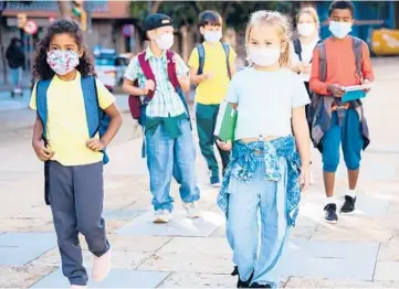  ?? DREAMSTIME ?? The Centers for Disease Control and Prevention recommends universal indoor masking for students, staff, teachers and visitors to schools, regardless of vaccinatio­n status.