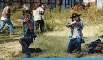  ??  ?? Andrew Lincoln as Rick Grimes, left, and Chandler Riggs as Carl Grimes.