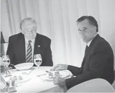  ?? DREW ANGERER, GETTY IMAGES ?? President-elect Donald Trump and former Republican presidenti­al nominee Mitt Romney dine on Nov. 29.