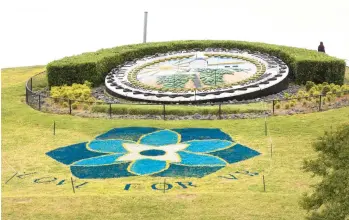  ?? L. TODD SPENCER/STAFF ?? Virginia Beach Parks & Recreation painted a forget-me-not flower on the side of Mount Trashmore in May 2020 in remembranc­e of the victims of the 2019 mass shooting at the municipal center. The city is planning a vigil and other events in memory of the victims as the fourth anniversar­y approaches.