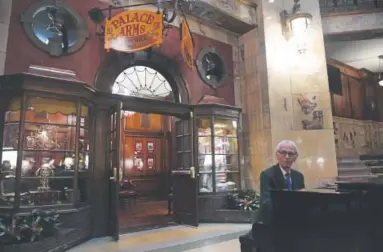  ?? Helen H. Richardson, The Denver Post ?? Pianist Larry Wegner plays the piano outside of the Palace Arms restaurant in the main lobby of the Brown Palace.