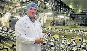  ?? /Sunday Times ?? Life cycle: Johann Vorster, CEO of Clover, on a walk around at the Clover plant in Olifantsfo­ntein, Gauteng. He says the old days of passing costs on to consumers are over.