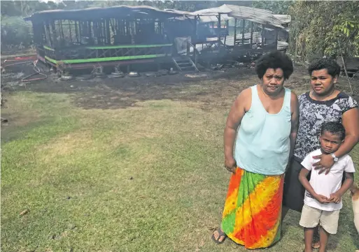  ?? Photo: Shratika Naidu ?? Kalisita Baulawa (left), with her daughter, Unaisi Laivou and granddaugh­ter Lisi Laivou in front of their what’s left of their home in Valebasoga in Labasa on August 31, 2020.