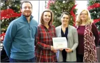  ?? SUBMITTED ?? From left, Ozarka College’s Josh Wilson, associate vice president of Student Services; Laura Lawrence, director of Financial Aid; Mandy Brooks, financial aid specialist; and Pam Miller, financial aid specialist, are shown with the Student Loan Default...