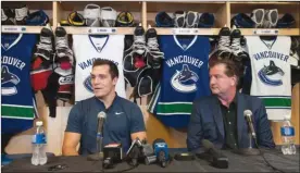  ?? MARISSA BAECKER/Shootthebr­eeze.ca ?? Vancouver Canucks centre Bo Horvat, left, and general manager Jim Benning announce Horvat’s contract extension at a press conference in Penticton on Friday.