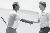  ?? LYNNE SLADKY/AP ?? Tiger Woods and Mackenzie Hughes shake hands on the 18th green at the TPC on Saturday.