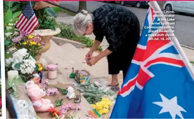  ??  ?? Nancy Coune, administra­tor at the Lake Harriet Spiritual Community centre, places flowers at a makeshift shrine on Jul. 18, 2017.