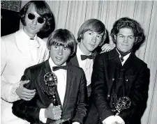  ?? AP ?? This 1967 file photo shows, from left, Mike Nesmith, Davy Jones, Peter Tork and Micky Dolenz of The Monkees, posing with their Emmy award for best comedy series at the 19th Annual Primetime Emmy Awards in Los Angeles. Tork, died yesterday.