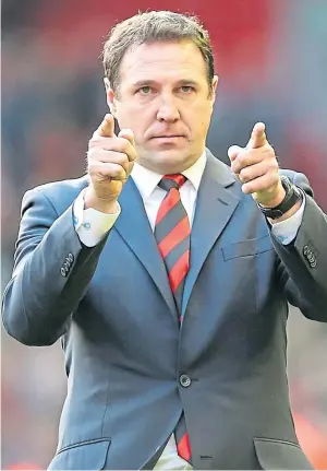  ?? Pictures: SNS/PA. ?? Left: Malky Mackay in the stands in his role as SFA performanc­e director and, above, during his time as Cardiff City manager.