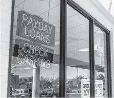  ?? Jonathan Weiss / Tribune News Service ?? Payday loans target Americans who are living paycheck to paycheck or are in financial distress.
