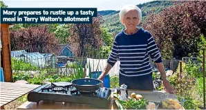  ?? ?? Mary prepares to rustle up a tasty meal in Terry Walton’s allotment