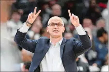  ?? NICK WASS/AP PHOTO ?? In this Feb. 4 file photo, UConn coach Dan Hurley gives instructio­ns to his team during a game against Georgetown in Washington.