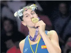  ?? EPA ?? Carolina Marin kisses the gold medal during the award ceremony.
