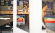  ?? Sarahbeth Maney / Special to The Chronicle 2020 ?? Kiera Perry sits socially distanced from other students in her kindergart­en class in November at Manteca’s Brock Elliott Elementary School in San Joaquin County.