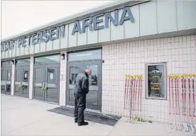  ?? JONATHAN HAYWARD THE CANADIAN PRESS ?? Hockey sticks are lined up at the Elgar Petersen Arena in Humboldt, Sask., in tribute to the 16 Humboldt Broncos players and team staff members who died after a bus crash in April.