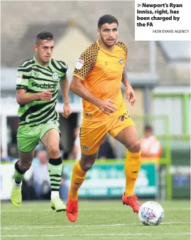  ?? HUW EVANS AGENCY ?? > Newport’s Ryan Inniss, right, has been charged by the FA