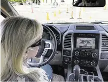  ?? Photo courtesy of Marlon Hanson ?? Sue Mead tries out Ford’s new Pro Backup Assist, using the rotary knob control and the F-150’s navigation screen to evaluate placement of a trailer during an exercise with Ford.