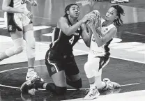  ??  ?? Former Wagner standout Kiana Williams of Stanford battles South Carolina’s Aliyah Boston for possession.