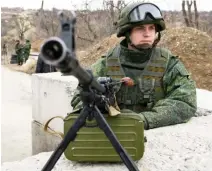  ??  ?? A separatist rebel guards a check point at the village of Luhanska, Ukraine, in this file photo. (AP)