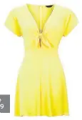  ??  ?? New Look yellow tie front playsuit, £19.99