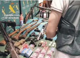  ??  ?? Weapons and other items seized during the raids