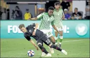  ?? AP FILE ?? D.C. United forward Griffin Yow (22) tries to maintain possession as he is pressured by Real Betis midfielder Wilfrid Kaptoum during a friendly soccer match on May 22, 2019.