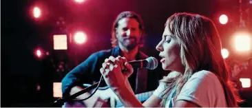  ?? [PHOTO BY WARNER BROS. PICTURES] ?? Lady Gaga and Bradley Cooper star in “A Star is Born.”