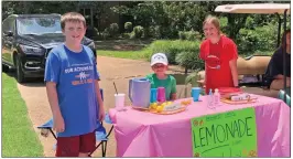  ?? SUBMITTED ?? Alex Miller, left, and his brother, Henry Cargile, center, and their baby sitter, Mary Frances Oxner, set up a lemonade stand and raised $84, half of which was donated to the United Way of White County.