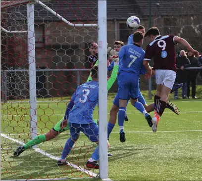  ??  ?? Roddy Patterson heads in the opening goal for Petershill during their 4-3 home defeat to Blantyre Vics