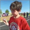  ??  ?? French Creek Elementary School fifth-grade student, Tyler Freire, checks his pedometer.