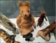  ?? KATE BRUMBACK — THE ASSOCIATED PRESS ?? This photo shows toys made by the Teddy Toy Company around 1930 and are early examples of Winnie-the-Pooh merchandis­e. Atlanta’s High Museum of Art is hosting an exhibition called “Winnie-the-Pooh: Exploring a Classic.”