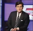  ?? RICHARD DREW — ASSOCIATED PRESS FILE PHOTO ?? Tucker Carlson, host of “Tucker Carlson Tonight,” poses for photos in a Fox News Channel studio on March 2, 2017, in New York.