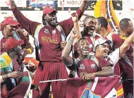  ?? FILE ?? West Indies’ cricketer Chris Gayle (centre), dances with his teammates to celebrate their win over Sri Lanka in the ICC Twenty20 Cricket World Cup final match in Colombo, Sri Lanka on October 7, 2012.