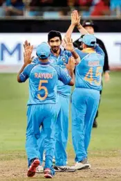  ??  ?? Jasprit Bumrah celebrates with teammates the dismissal of Pakistan's Faheem Ashraf during the one day internatio­nal cricket match of Asia Cup between India and Pakistan in Dubai on Wednesday