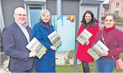  ?? ?? Designs on success Gill White (second right) is welcomed to the new artist cabin in Winchburgh