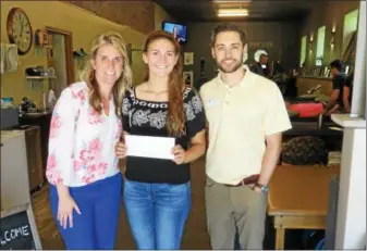  ?? PHOTO PROVIDED. ?? Local business owners Erin and Joe Napoleone of Choice Physical Therapy present Catholic Central High School graduate Jane Field with the third annual Choice Physical Therapy Scholarshi­p Award. Field is attending Utica College in the fall, pursuing a Doctorate degree in Physical Therapy.