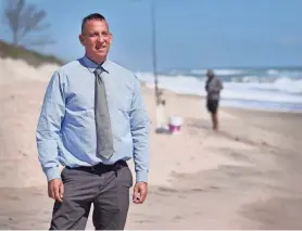  ?? MALCOLM DENEMARK/FLORIDA TODAY ?? Dr. Robert Abarbanell, who is running for the District 3 Brevard County Commission seat, stands on the beach at the Indian River Oaks beach access. He is running because of the ongoing conflict between homeowners and anglers who fish for sharks in front of his and his neighbors’ beachfront properties near the beach access.