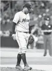  ?? JULIO AGUILAR/GETTY ?? The Marlins’ Elieser Hernandez reacts after the Rays’ Eric Sogard hit a three-run homer in the third inning at Tropicana Field.