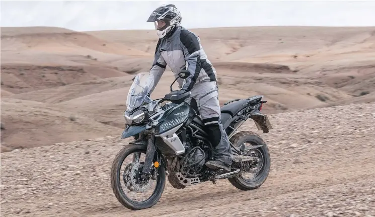  ?? PHOTOS: COSTA MOUZOURIS/DRIVING.CA ?? The XC’s softer suspension is better suited for rough terrain. The bike is quick, steers precisely and rides over big bumps without bottoming. The Tiger features a 5-inch, configurab­le TFT colour screen. USB ports are standard on all models.