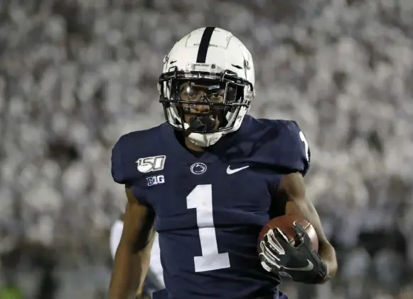  ?? Gene J. Puskar,The Associated Press ?? Penn State wide receiver KJ Hamler scores after catching a pass from quarterbac­k Sean Clifford on Oct. 19 against Michigan in State College, Pa.