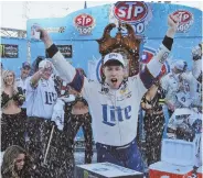  ?? AP PHOTO ?? AT LONG LAST: Brad Keselowski celebrates with his crew after his first career victory at Martinsvil­le Speedway yesterday.